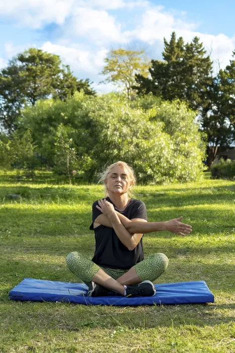 Framed Print : Woman doing stretching exercises in sunny park Framed Print : Woman doing stretching exercises in sunny park