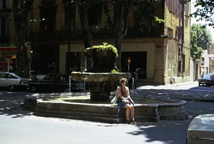 Framed Print : Woman at a fountain in the historic centre of Aix en Provence, France 1974