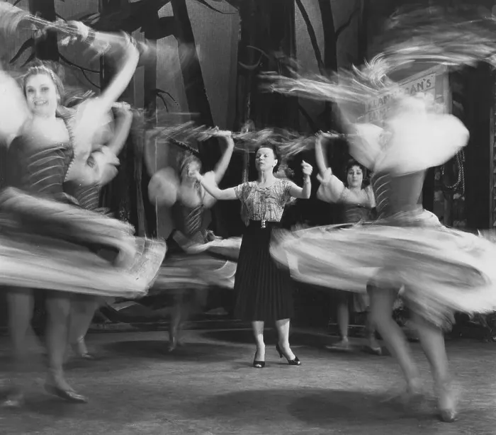 Framed Print : Woman giving lessons to female dancers