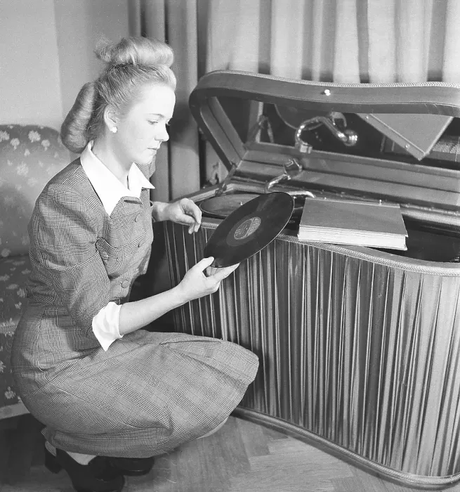 Framed Print : Woman at a gramophone in the 1940s