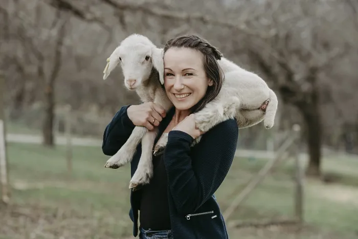 Framed Print : Woman with lamb on her shoulders, Austria