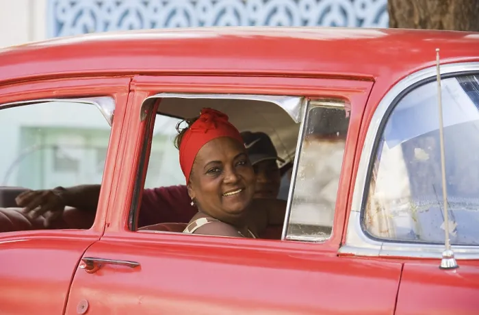 Framed Print : Woman looking out of a car window