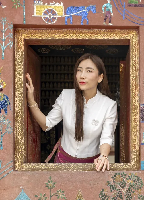 Framed Print : Woman looks out the window at Wat Xieng Thong Framed Print : Woman looks out the window at Wat Xieng Thong