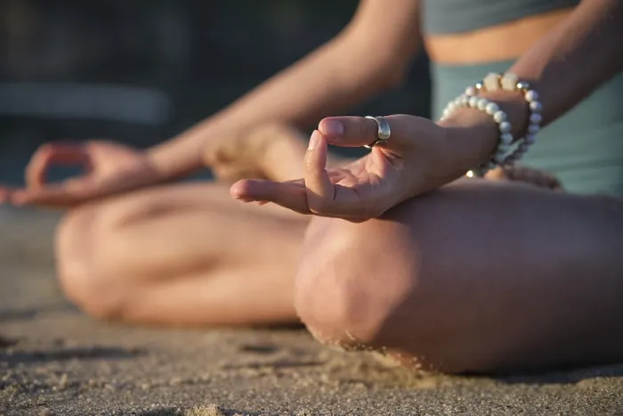 Framed Print : Woman meditates in Padmasana on the beach