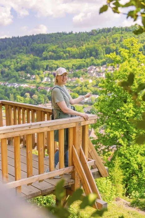 Framed Print : Woman on the platform presents the view over the valley and the surrounding hills