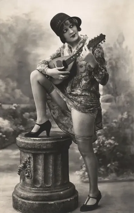 Framed Print : Woman playing plucking instrument