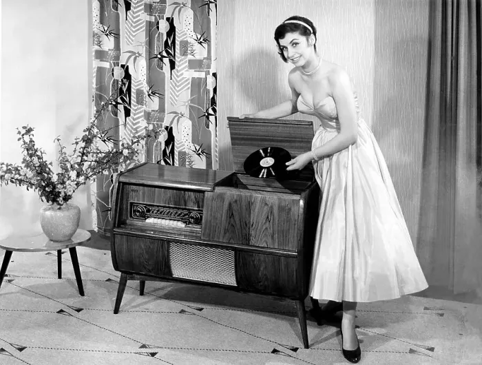 Framed Print : Woman posing next to a record player Framed Print : Woman posing next to a record player