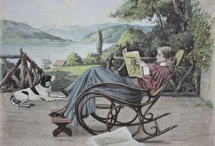 Framed Print : Woman reading a newspaper in a rocking chair