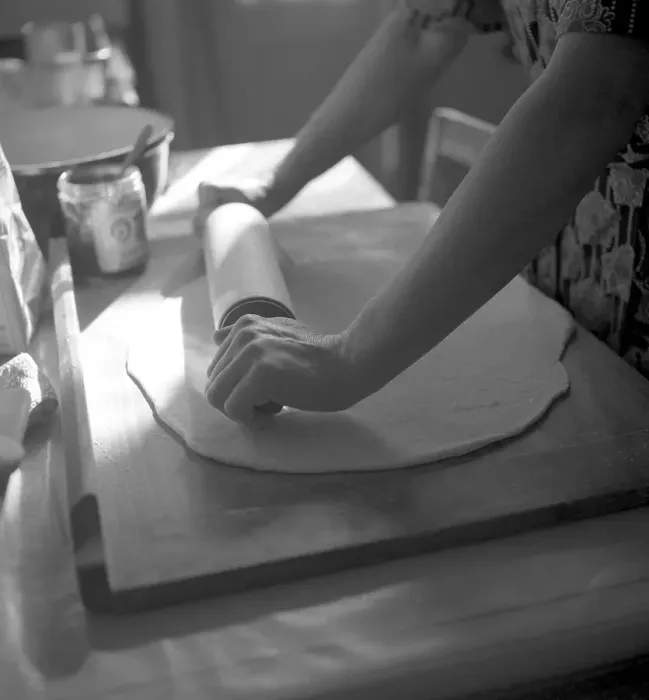 Framed Print : Woman rolls dough flat, housewife bakes Framed Print : Woman rolls dough flat, housewife bakes
