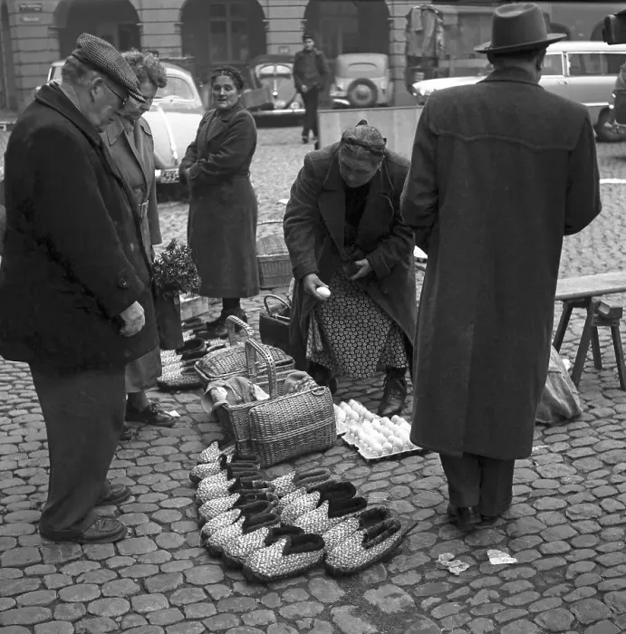 Framed Print : Woman sells different things (shoes)