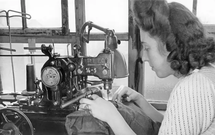 Framed Print : Woman sewing on a sewing machine Framed Print : Woman sewing on a sewing machine