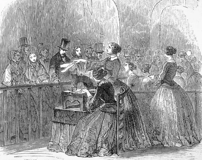 Framed Print : One woman sews on the sewing machine
