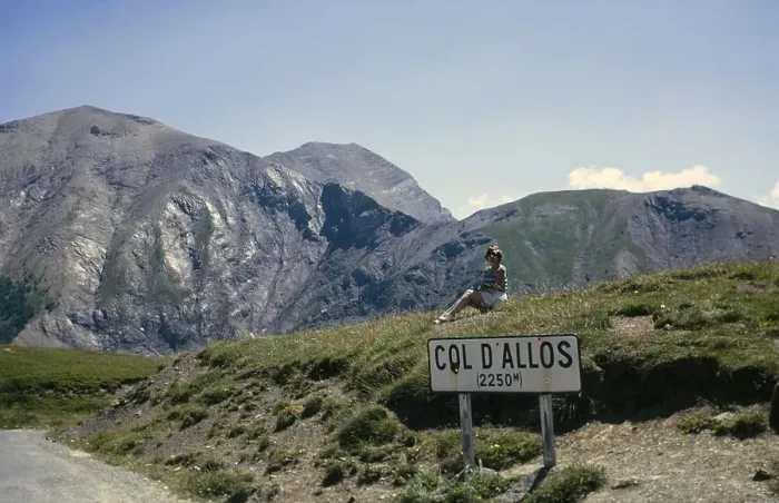 Framed Print : Woman sitting at sign for Col d'Allos 2250m Alpine pass, Alpes-de-Haute-Provence, France 1974 Framed Print : Woman sitting at sign for Col d'Allos 2250m Alpine pass, Alpes-de-Haute-Provence, France 1974