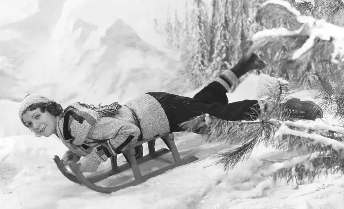 Framed Print : Woman on a sledge 1930s. The young actress Isa Quensel