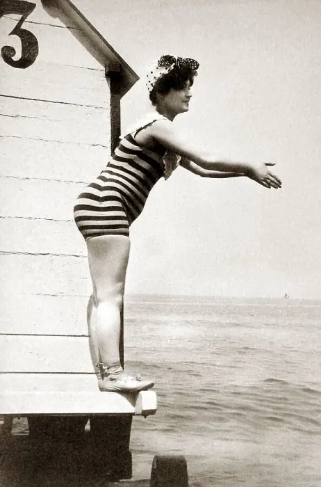 Framed Print : Woman in striped swimsuit wants to jump into the water Framed Print : Woman in striped swimsuit wants to jump into the water