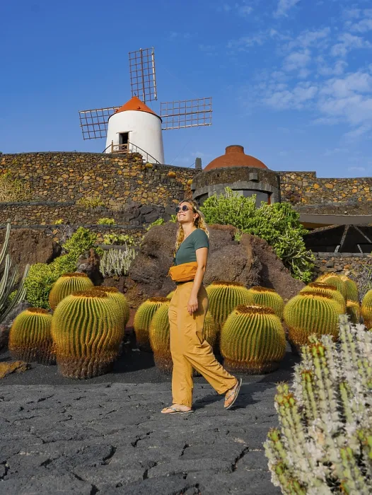 Framed Print : A woman strolls near a traditional windmill surrounded by cacti in Lanzarote Framed Print : A woman strolls near a traditional windmill surrounded by cacti in Lanzarote