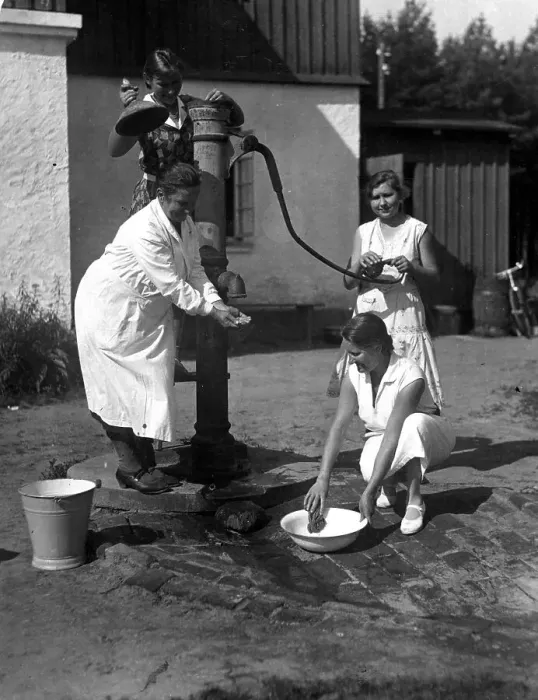 Framed Print : Three women fetching water from a pump Framed Print : Three women fetching water from a pump