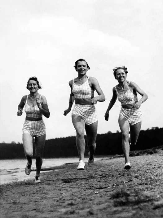 Framed Print : Three women jogging on the beach