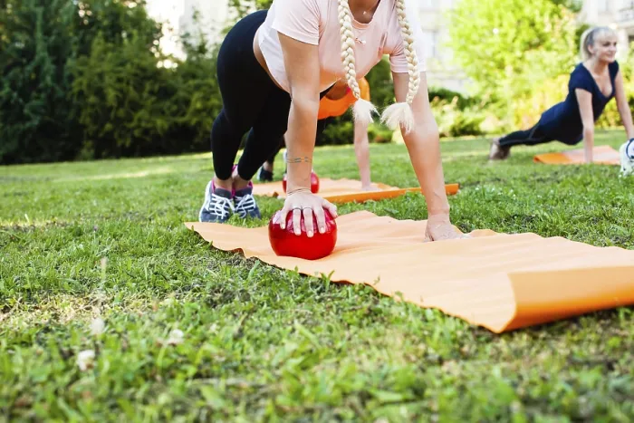 Framed Print : Women in the park are doing exercise with fitness balls