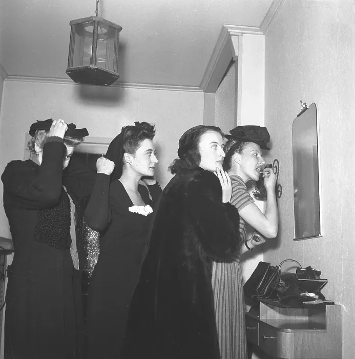 Framed Print : Women prepares for a night out in the 1940s