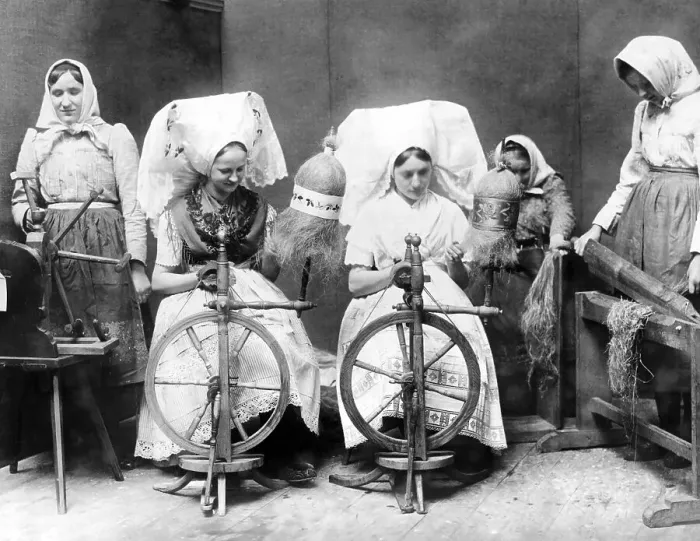 Framed Print : Women in traditional traditional costume spinning flax