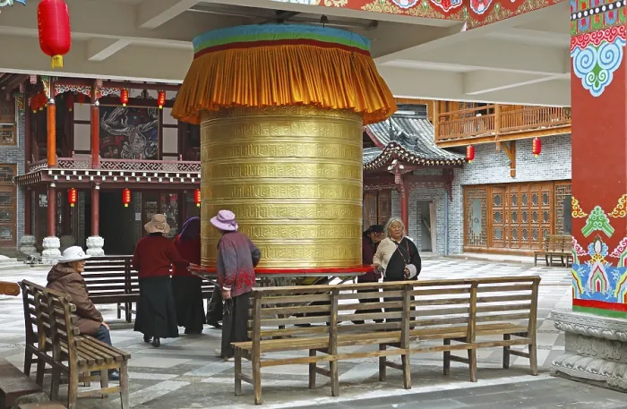 Framed Print : Women turn a prayer wheel, Kangding