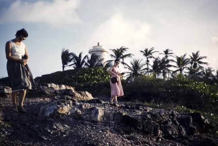 Framed Print : Two women walking on rocky shoreline on the coast at Toco, Trinidad c 1963