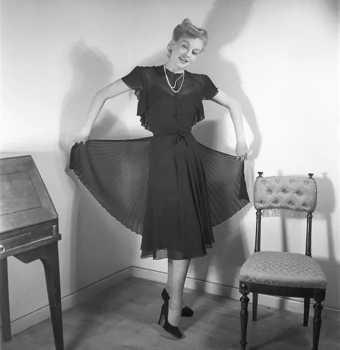 Framed Print : Women's fashion in the 1940s. A young woman photographed for a ladies magazine to show the women's fashion of 1945 Framed Print : Women's fashion in the 1940s. A young woman photographed for a ladies magazine to show the women's fashion of 1945
