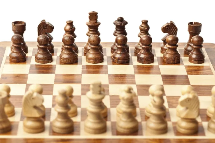 Framed Print : Wooden chess pieces on chessboard