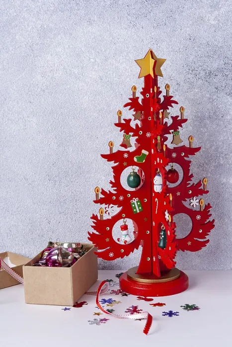 Framed Print : Wooden Christmas tree red and a box with toys