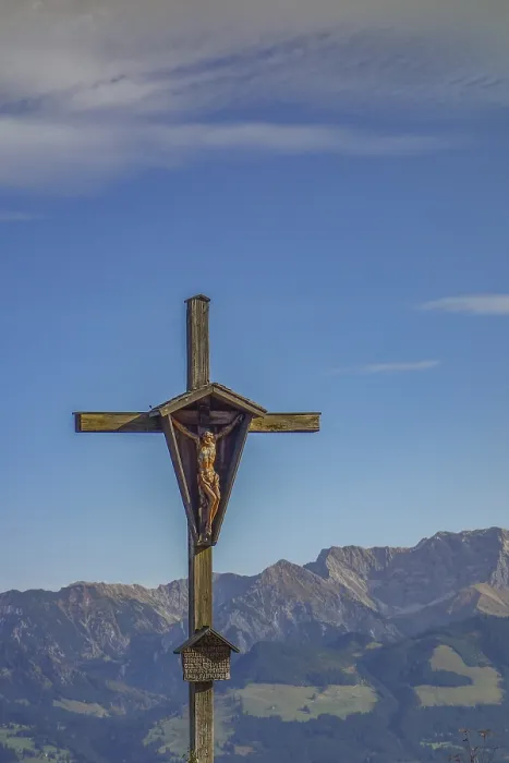 Framed Print : Wooden cross in front of mountain landscape under clear sky Framed Print : Wooden cross in front of mountain landscape under clear sky