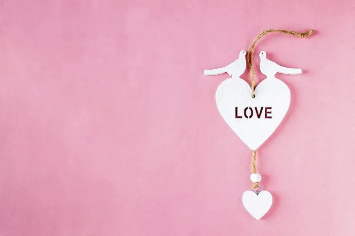 Framed Print : Wooden heart on pink background, copy space