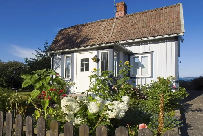 Framed Print : Wooden house with front garden in the small place Framed Print : Wooden house with front garden in the small place