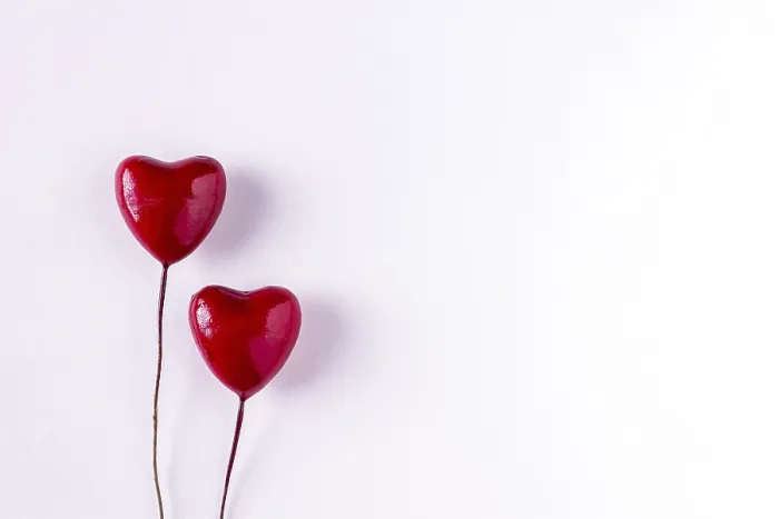 Framed Print : Two wooden red hearts on white background Framed Print : Two wooden red hearts on white background