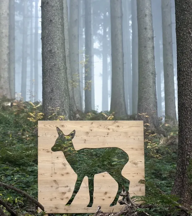 Framed Print : Wooden stencil of a deer in a forest