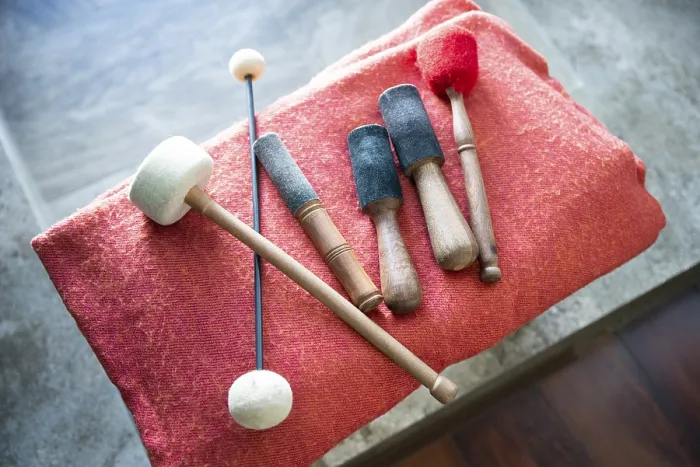 Framed Print : Wooden sticks for sound therapy with singing bowls in spa salon Framed Print : Wooden sticks for sound therapy with singing bowls in spa salon