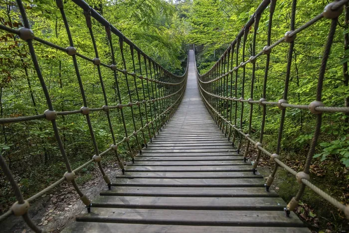 Framed Print : Wooden suspension bridge over a gorge