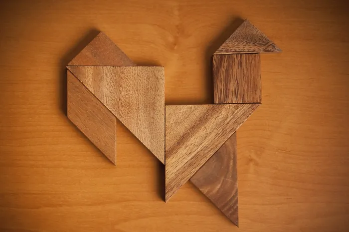 Framed Print : A wooden tangram puzzle arranged into a rooster shape