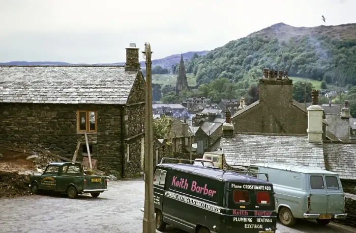 Framed Print : Work vehicles parked in the village of Ambleside, Lake District, Cumbria, England, UK 1973