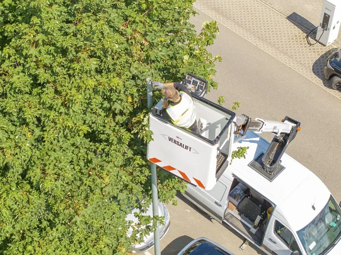 Framed Print : A worker in an aerial work platform cuts branches from a tree Framed Print : A worker in an aerial work platform cuts branches from a tree