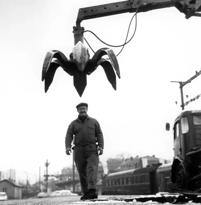Framed Print : Worker under crane, ca. 1970s, exact location unknown