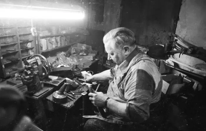 Framed Print : In the workshop of a Schumacher as a sole trader on 12