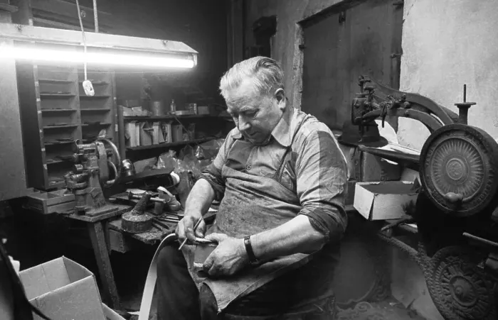 Framed Print : In the workshop of a Schumacher as a sole trader on 12