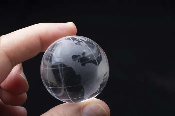 Framed Print : World globe crystal glass in hand