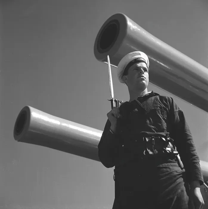 Framed Print : During World war II. The war ship Sverige during navy exercises at sea. Detail of a sailor standing guard on the ship with a rifle in his hand. Sweden june 1940. Kristoffersson ref 141 Framed Print : During World war II. The war ship Sverige during navy exercises at sea. Detail of a sailor standing guard on the ship with a rifle in his hand. Sweden june 1940. Kristoffersson ref 141
