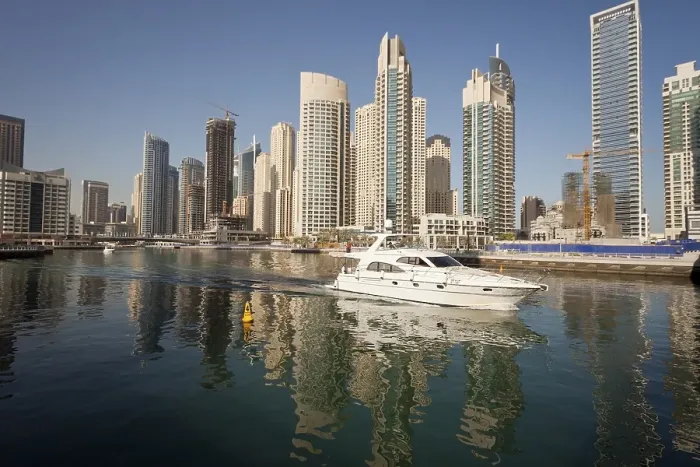 Framed Print : Yacht in front of the skyscrapers of Dubai Marina Framed Print : Yacht in front of the skyscrapers of Dubai Marina