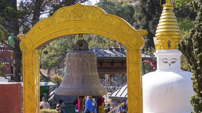 Framed Print : A yellow bell tower frames a large bell with a nearby stupa