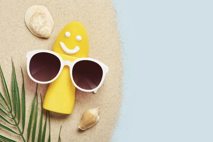 Framed Print : Yellow tube with happy sunscreen face and sunglasses Framed Print : Yellow tube with happy sunscreen face and sunglasses