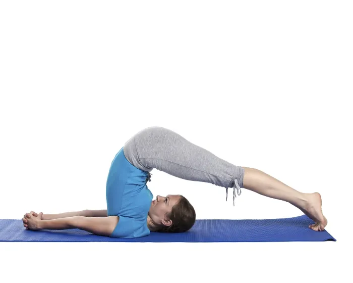Framed Print : Yoga, young beautiful woman yoga instructor doing Plow pose asana (halasana) exercise isolated on white background