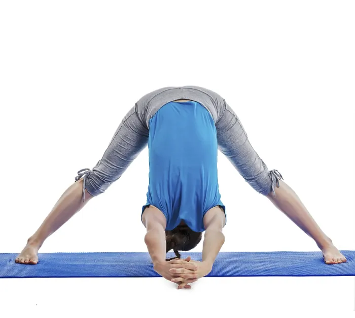 Framed Print : Yoga, young beautiful woman yoga instructor doing Wide Legged Forward Bend C pose (Prasarita Padottanasana C)